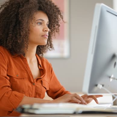 woman typing at computer