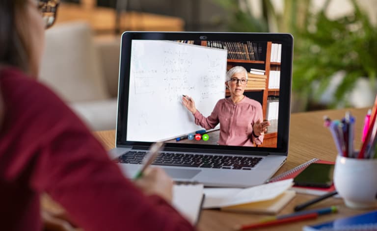 person watching training session on laptop